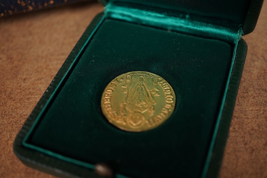 A leather travelling watch case, with nickel case goliath pocket watch, retailed by Asprey, with Roman dial and subsidiary seconds, case diameter 67mm.